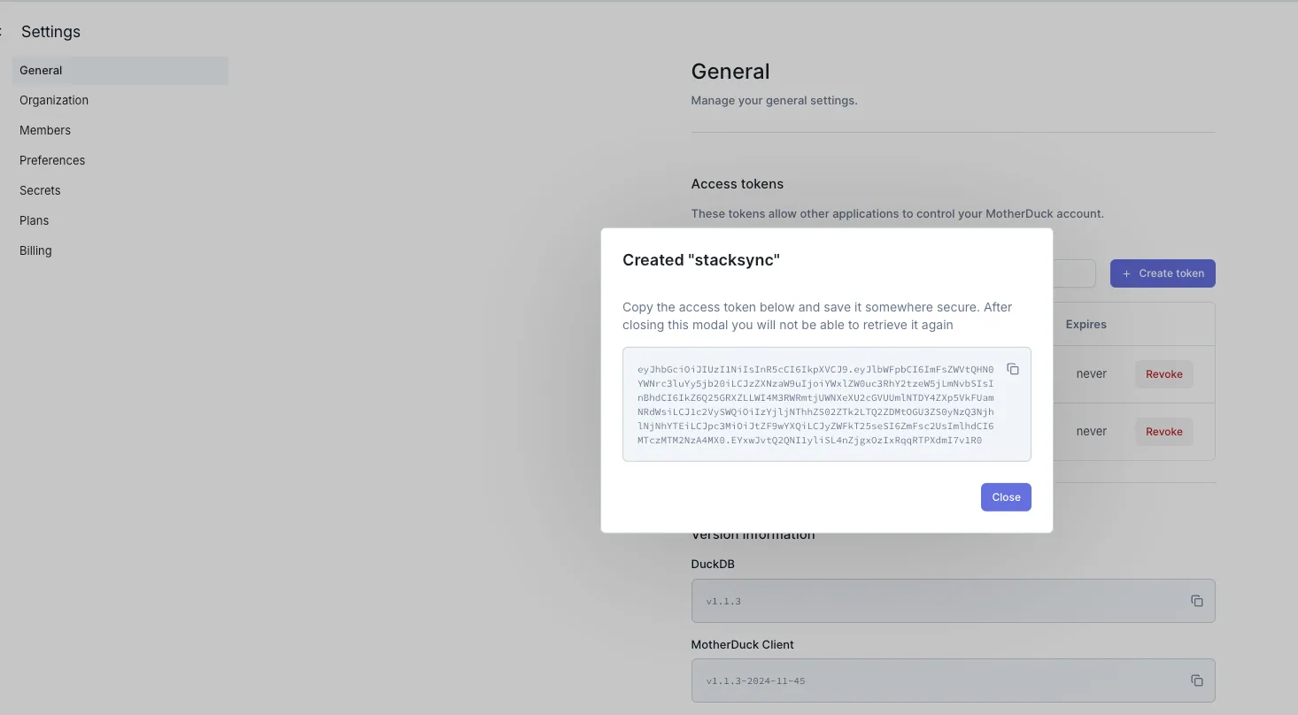 MotherDuck "Created stacksync" dialog showing the generated access token to copy before closing.