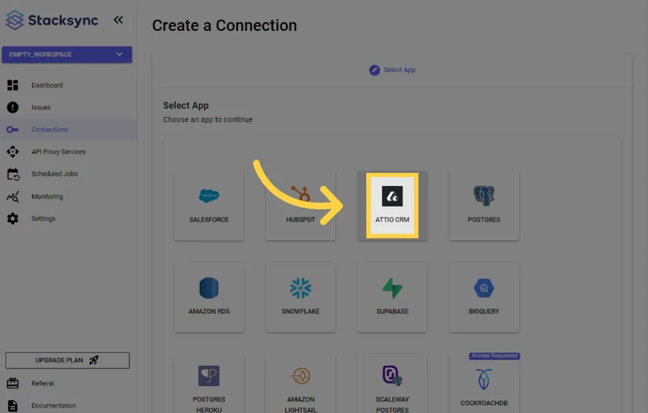Legacy Stacksync "Create a Connection" app picker with an arrow pointing to "Attio CRM"
