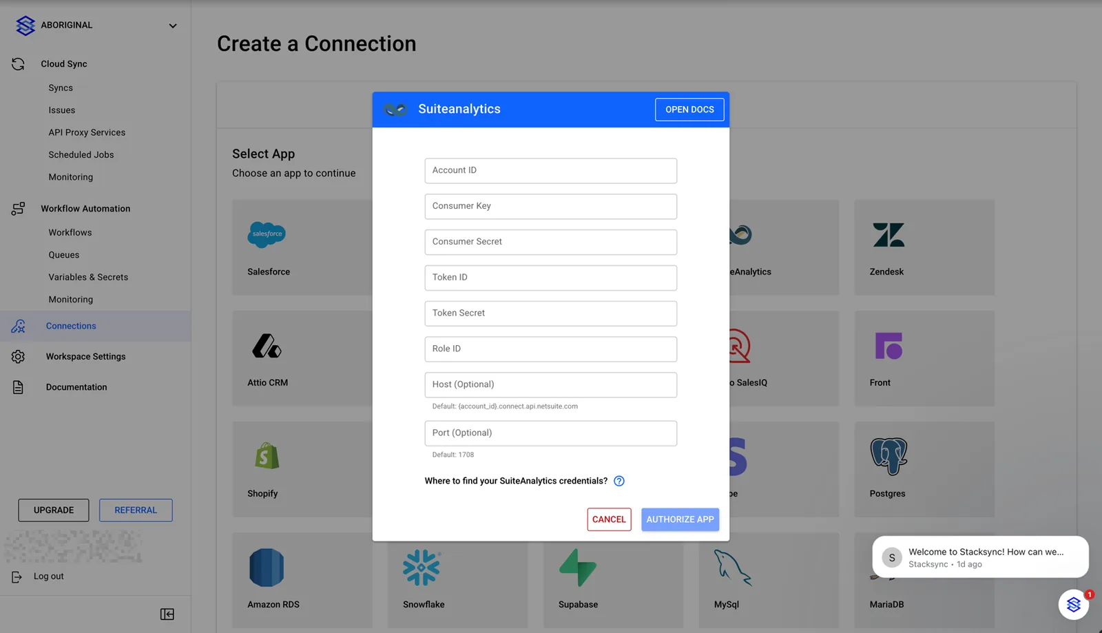 Stacksync SuiteAnalytics dialog with Account ID, Consumer Key/Secret, Token ID/Secret, Role ID, optional Host and Port, and "Authorize App".