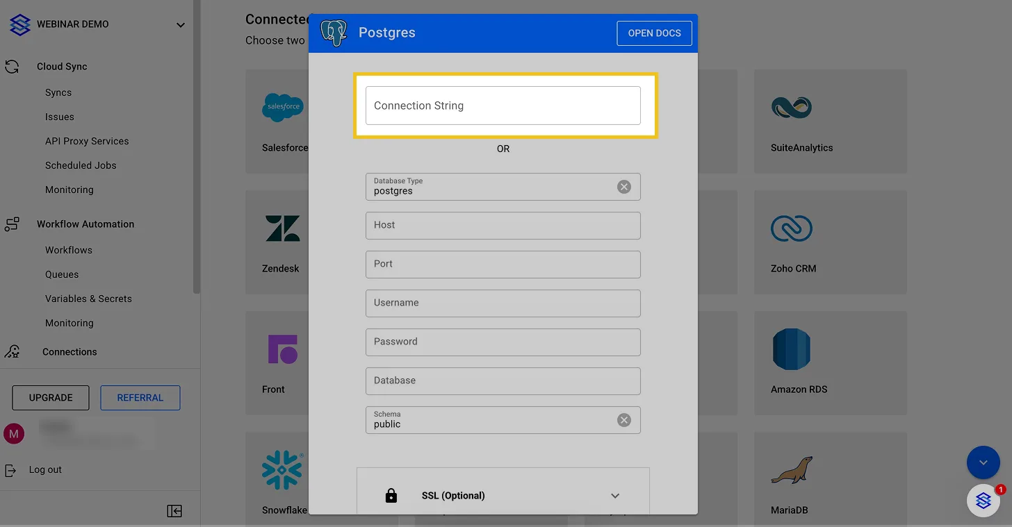 Stacksync Postgres connection dialog with the "Connection String" field highlighted above the host, port and user fields